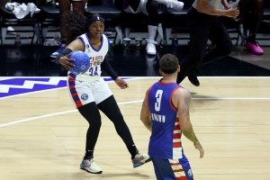 SALT LAKE CITY, UTAH - FEBRUARY 17: Basketball player Arike Ogunbowale #24 of Team Dwayne dribbles against country music singer Kane Brown #3 of Team Ryan during the second quarter in the 2023 NBA All Star Ruffles Celebrity Game at Vivint Arena on February 17, 2023 in Salt Lake City, Utah. NOTE TO USER: User expressly acknowledges and agrees that, by downloading and or using this photograph, User is consenting to the terms and conditions of the Getty Images License Agreement. (Photo by Tim Nwachukwu/Getty Images)