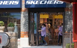 SHANGHAI, CHINA - JUNE 16: Staff prepare to open a Skechers store in Disneytown on June 16, 2022 in Shanghai, China. Disneytown and the Shanghai Disneyland Hotel have resumed operations today, coinciding with the sixth anniversary of the opening of the Shanghai Disney Resort. (Photo by Hu Chengwei/Getty Images)