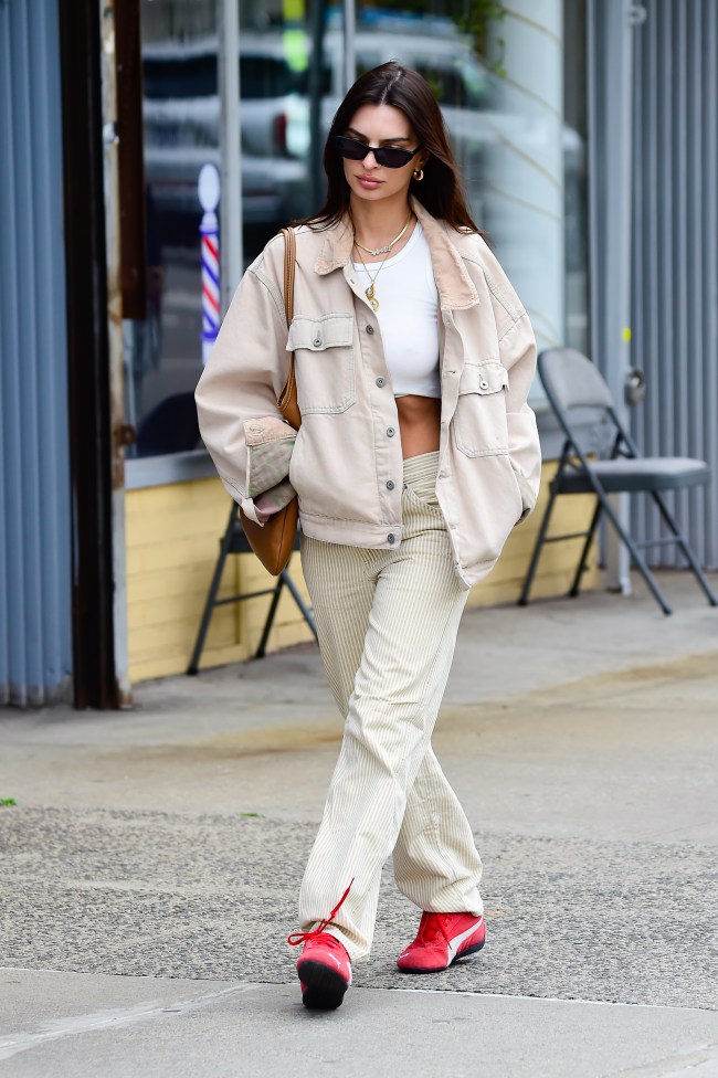 Emily Ratajkowski is seen on April 17, wearing red Puma Speedcat sneakers