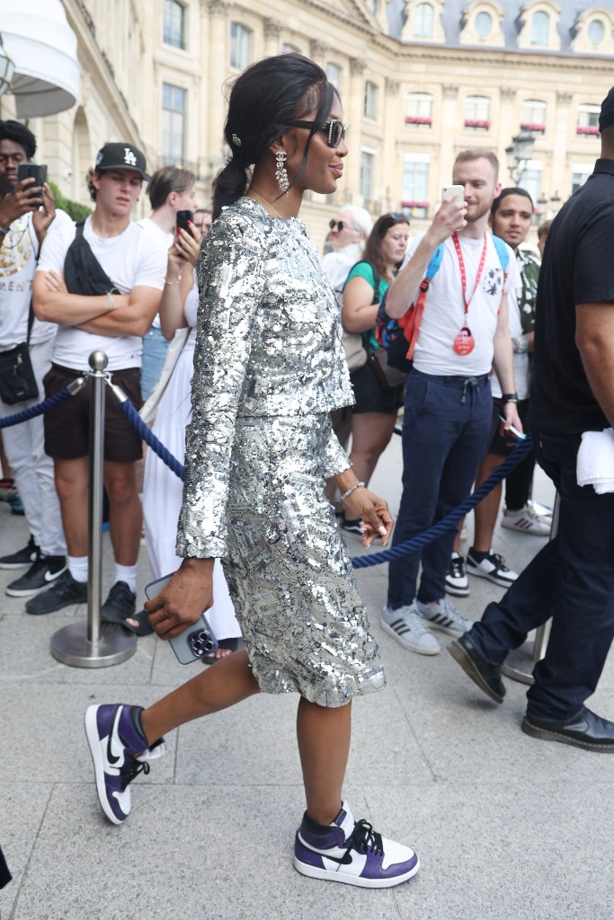 Naomi Campbell is seen wearing Nike Air Jordan 1 shoes with a silver sequin outfit in Paris