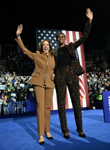 US Vice President and Democratic presidential candidate Kamala Harris (L) and former US First Lady Michelle Obama arrive to speak at a campaign rally in Kalamazoo, Michigan, on October 26, 2024. (Photo by Brendan SMIALOWSKI / AFP) (Photo by BRENDAN SMIALOWSKI/AFP via Getty Images)