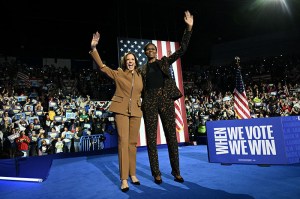 US Vice President and Democratic presidential candidate Kamala Harris (L) and former US First Lady Michelle Obama arrive to speak at a campaign rally in Kalamazoo, Michigan, on October 26, 2024. (Photo by Brendan SMIALOWSKI / AFP) (Photo by BRENDAN SMIALOWSKI/AFP via Getty Images)