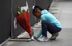 Dharma Brown, 8, of Los Angeles, writes a note to the late Kobe Bryant outside of the Staples Center prior to the start of the 62nd annual Grammy Awards at the Staples Center, in Los Angeles. Bryant died Sunday in a helicopter crash near Calabasas, Calif. He was 41Kobe Bryant, Los Angeles, USA - 26 Jan 2020