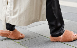 woman walking in pink furry slippers